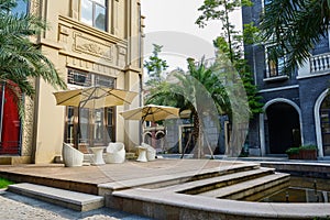 Planked platform by fountain before European-style building in a