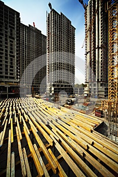 On planking between buildings under construction photo