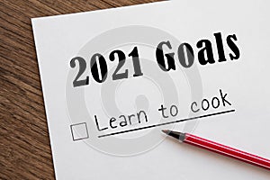 Planner of goals and plans for 2021, a sheet of paper with the inscription learn to cook from to do list