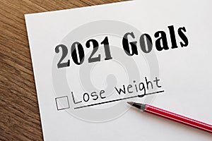 Planner of goals and plans for 2021, a sheet of paper with the inscription lose weight