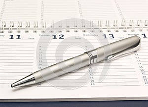 Planner with a pen