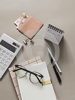 Planning, accounting of income expenses. Business finance concept. Accessories - planner, calculator, calendar on a light