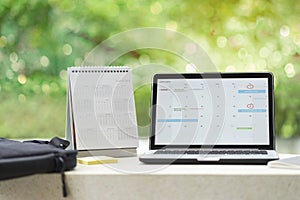 Planning agenda and schedule using calendar event planner on computer laptop. Calender planner organization management remind