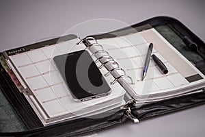 Planning concept - calendar, cellphone, pen