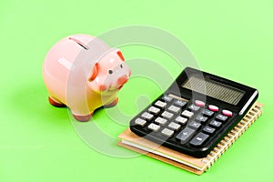 Planning counting budget. Commerece business. capital management. moneybox with calculator. Piggy bank. money saving