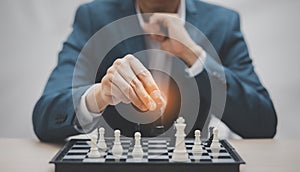 Planning and Decision concept, Businessman with strategy competitive ideas concept with chess board game. Business competition, Fi