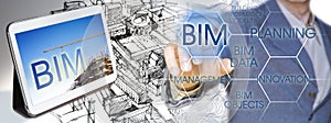 Planning a new city with BIM, Building Information Modeling system, a new way of architecture designing - concept with an engineer