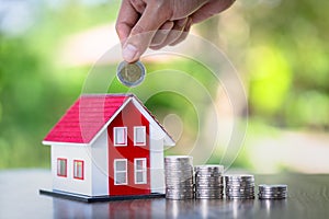 Planning savings money of coins to buy a home, concept for property ladder, mortgage and real estate investment. for saving or