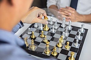 Planning and Strategic concept, Businessman playing chess and thinking strategy about crash overthrow the opposite team and