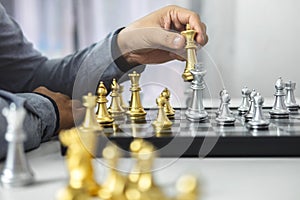 Planning and Strategic concept, Businessman playing chess and thinking strategy about crash overthrow the opposite team and