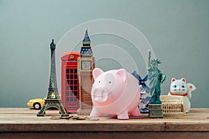 Planning summer vacation, budget trip concept with piggy bank.