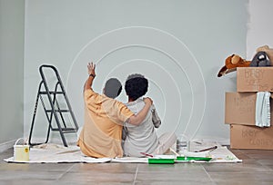 Planning, wall or black couple pointing in home renovation, diy or house remodel together on floor. Back view, painting