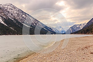 Plansee lake frozen on the end of winter, Tyrol, Austria.