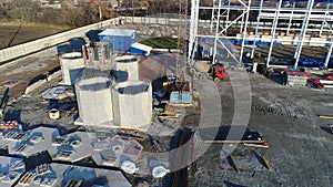 Plant Construction, Construction of a large factory, Industrial exterior, Construction site, aerial view, metal and