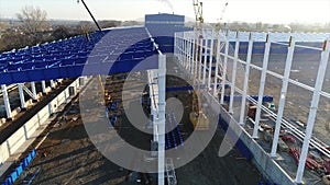 Plant Construction, Construction of a large factory, Industrial exterior, Construction site, aerial view, metal and