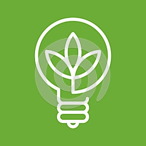 Plant inside lightbulb. Concept of green energy and environmental