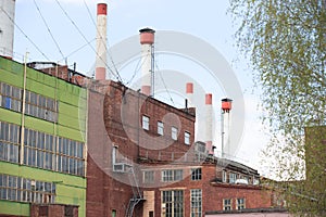 .Buildings of the plant with pipes.