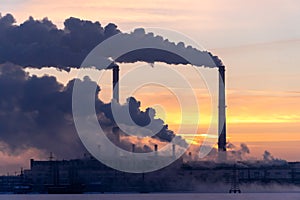 Plant pipes pollute atmosphere. Industrial factory pollution