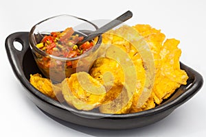 Plantain cup and patacones on white background