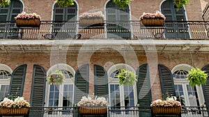 planter boxes on a historic building in the french quarter