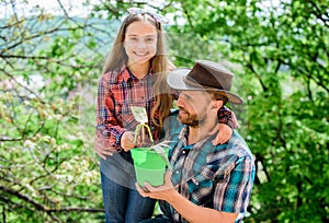 Planting flowers. Family dad and daughter planting plants. Plant your favorite veggies. Planting season. Family garden