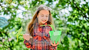 Planting season. Child adorable kid hold flower pot and hoe gardening tool. Gardening is peaceful meditative occupation