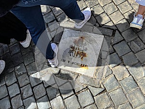 A plaque among the paving stones in St. Peter's Square in the Vatican commemorating the site of the assassination attempt