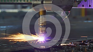 Plasma cutting machine cuts metal material with sparks