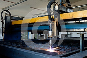 Plasma cutting machine, flame with sparks, metal cut process, metal cutting