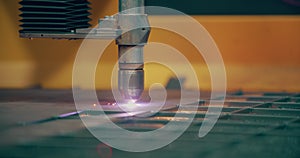 Plasma laser cutting metal sheet with sparks Welding