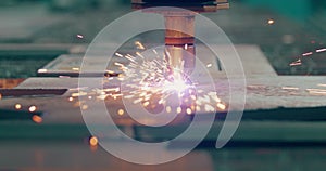 Plasma laser cutting metal sheet with sparks Welding