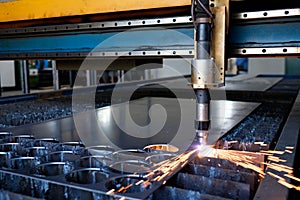 Plasma machine cutting a sheet of metal, metal cut process, metal cutting