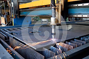 Plasma machine cutting a sheet of metal, metal cut process, metal cutting