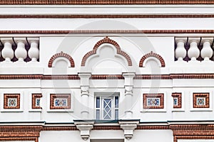 Plaster and decor in classic architecture. Fragment of the facade of the historically traditional architecture of the building.