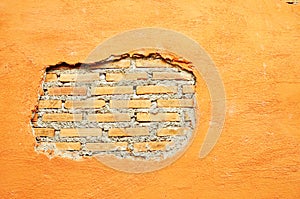 Plaster and Red brick wall damage