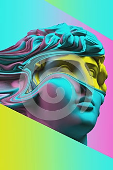 Plaster sculpture of young man face in a pop art style. Statue of Antinous head. Creative concept colorful neon image photo
