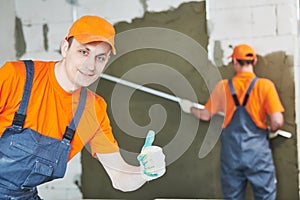 Plaster service. portrait of male plasterer