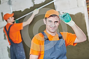 Plaster service. portrait of male plasterer