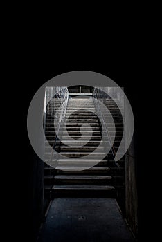 Plaster steps leading up to the ground floor from an underground tunnel of the modern hip tropical resort in Chiang Mai.