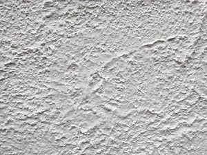Plaster texture, close-up. White texture putty wall, rough grunge background.
