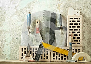 Construction tools in a row and bricks.Building and renovation concept.