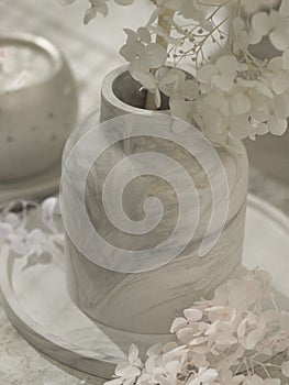 Plaster vase with bouquet of stabilized hydrangeas. Minimalist interior design. Kinfolk, hygge, scandinavian style