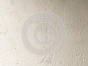 A plaster wall texture. Old wall painted white close-up. Light abstract background.