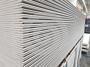 plasterboard sheets stacked in a hardware store. building material.