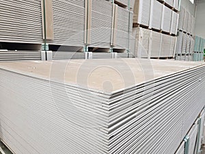 plasterboard sheets stacked in a hardware store. building material.