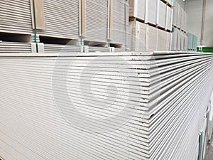 plasterboard sheets stacked in a hardware store. building material.