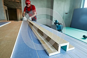 Plasterboard work. worker assembling gypsum drywall construction photo