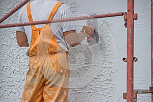 Plasterer applying a finish coating to a wall 2