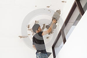 Plasterer at ceiling renovation decoration