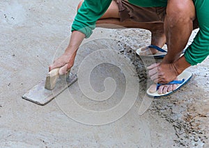 plasterer concrete worker at floor of house construction